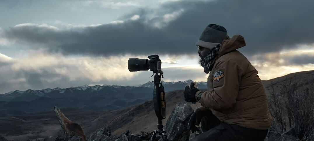 Photographer shooting a documentary report on location